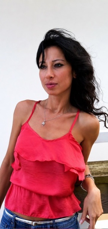 Gül Ateş standing outdoors under the open sky